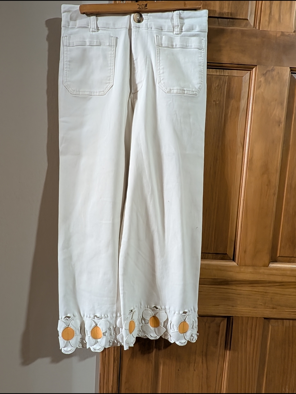 Anthropologie White Wide-Leg Pants with Yellow / Orange Daisy Hem Accents